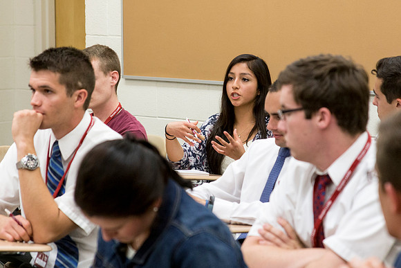 Students discuss what they learned during the first session together during a "breakout".