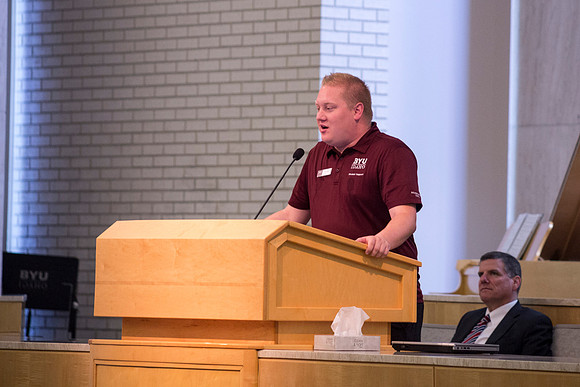 A Disciple Leader Council member introduces Religious Education Faculty member President Ross Baron during one of the Workshops.