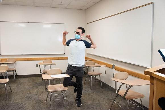 Examples of students staying safe and healthy during the COVID-19 pandemic by social distancing, following pathway arrows, and wearing face masks.