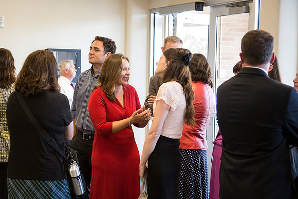 BYU-Idaho Faculty speak together as they wait for the banquet to begin.