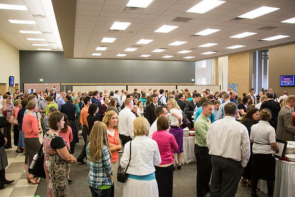 BYU-Idaho Faculty speak together as they wait for the banquet to begin.