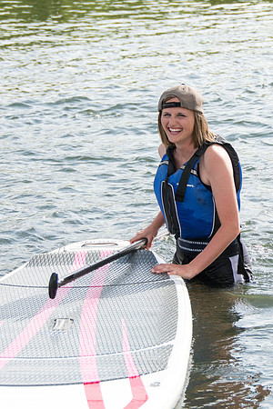 Students of Brigham Young University-Idaho go standup paddle boarding on the river at Warm Slough.