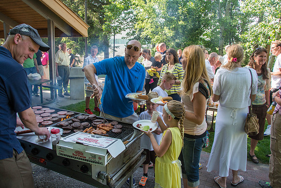 Ricks College Alumni, who competed in basketball, come together for a BBQ dinner with their families.