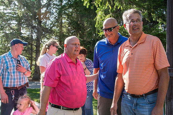 Ricks College Alumni, who competed in basketball, come together for a BBQ dinner with their families.