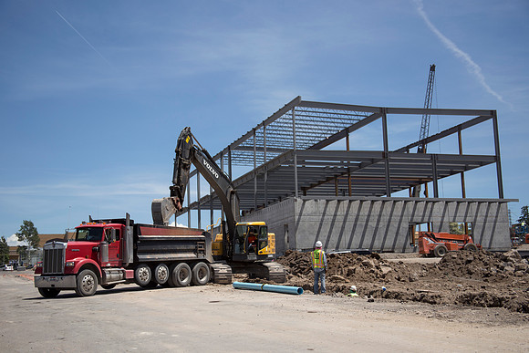Work continues on the new Science and Technology building. Sage St. alongside the Austin Building was blasted to install the utility services.