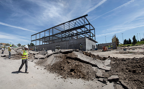 Work continues on the new Science and Technology building. Sage St. alongside the Austin Building was blasted to install the utility services.