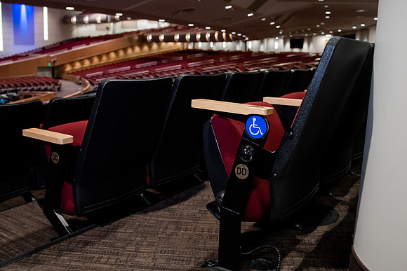 Ushers perform their duties in the I-Center to prepare for devotional. Used for an usher training video.