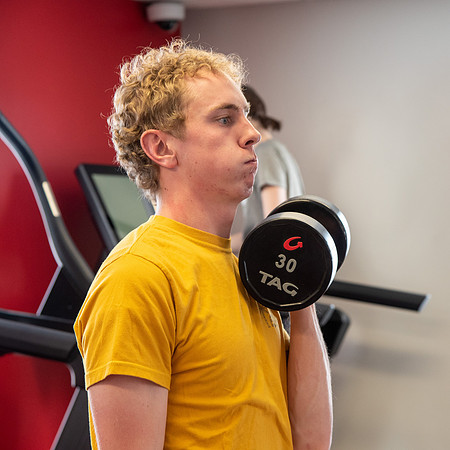 Students work out in the fitness room.