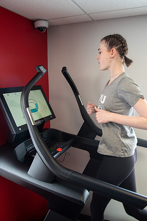 Students work out in the fitness room.