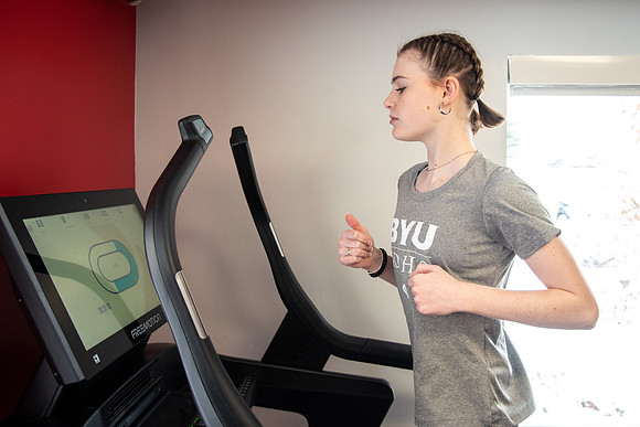 Students work out in the fitness room.