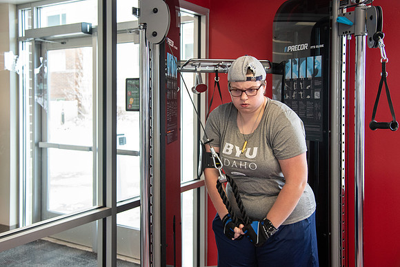 Students work out in the fitness room.