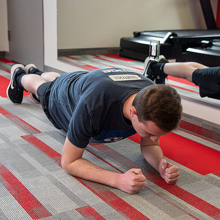 Students work out in the fitness room.