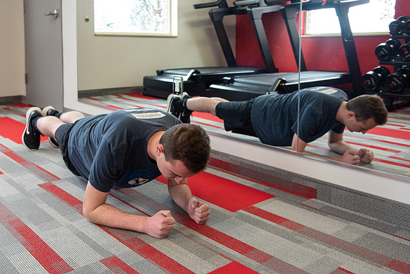Students work out in the fitness room.