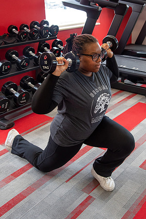 Students work out in the fitness room.