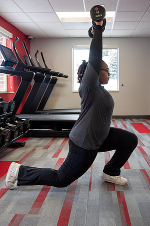 Students work out in the fitness room.