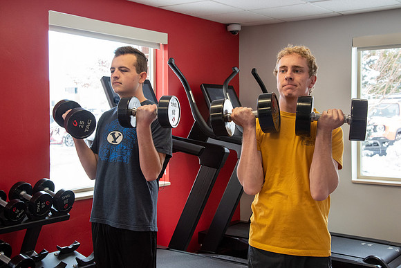 Students work out in the fitness room.
