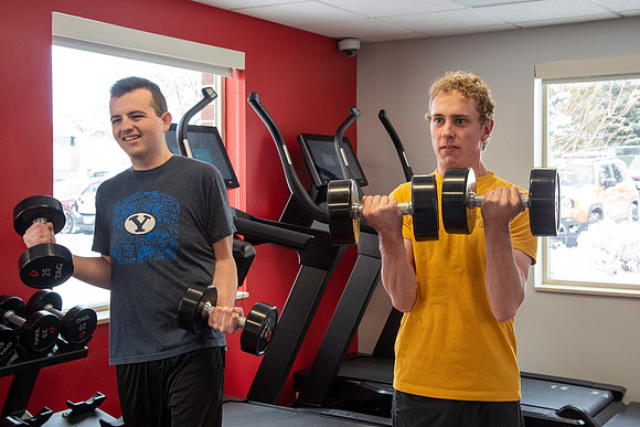 Students work out in the fitness room.