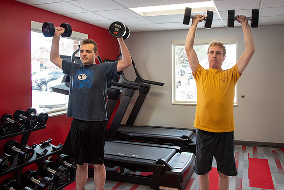 Students work out in the fitness room.