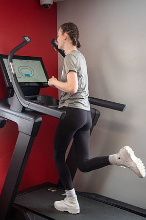 Students work out in the fitness room.