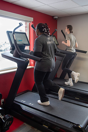 Students work out in the fitness room.