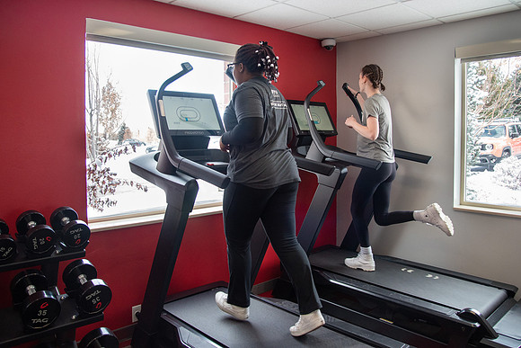 Students work out in the fitness room.
