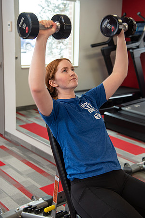 Students work out in the fitness room.
