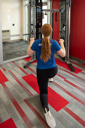 Students work out in the fitness room.