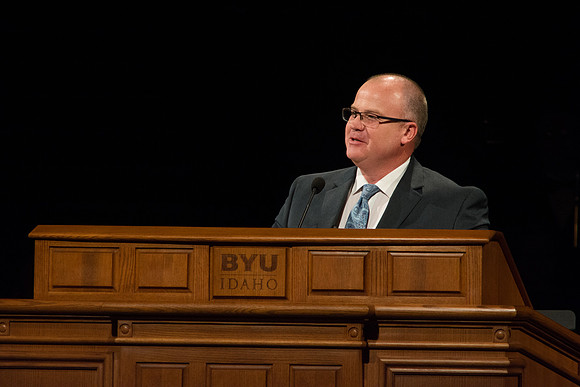 Aaron Sanns, Director of Financial Aid & Scholarships, speaks at Devotional.