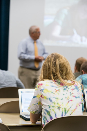Brother Duane Adamson talks to his Political Science class in the Hinckley Building during the 2014 Spring Semester.