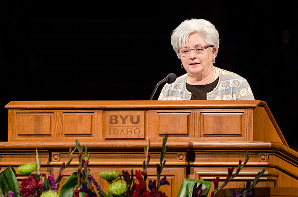 Sister Thueson, matron of the Rexburg Temple, speaks at devotional.