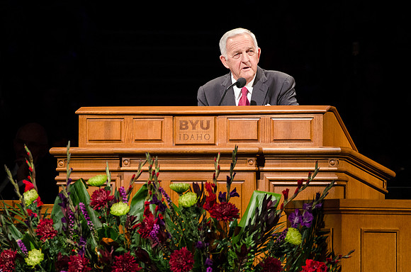 Clair Thueson, president of the Rexburg Temple, speaks at devotional.