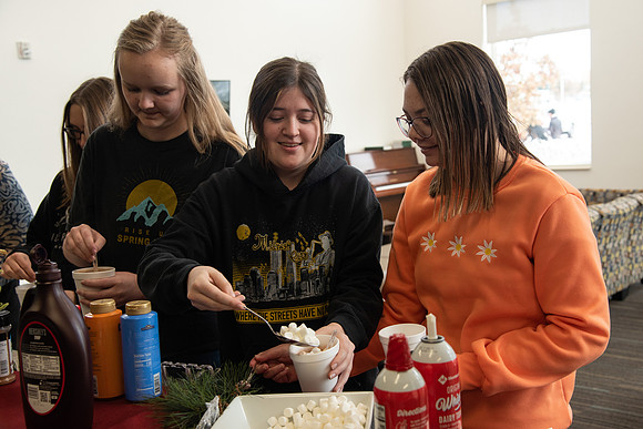 Students at Center Square enjoy some hot chocolate.
