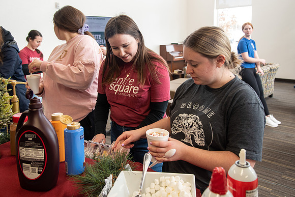 Students at Center Square enjoy some hot chocolate.