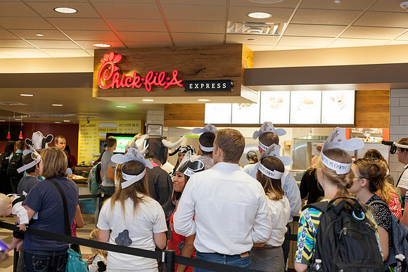 Faculty and students dress in their best "cow" outfit in order to get a free meal at Chick-Fil-A.