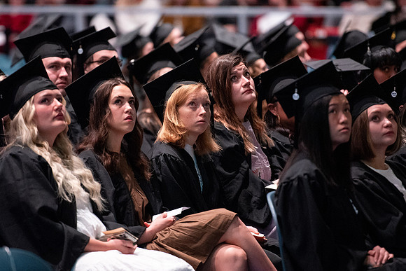 Graduates receive their diplomas during Performing and Visual Arts convocation.