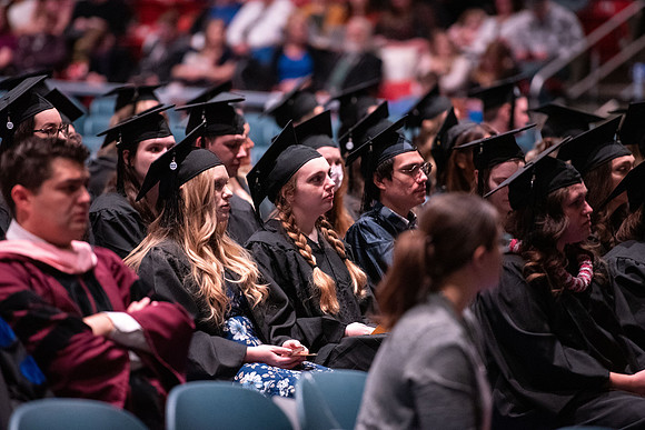 Graduates receive their diplomas during Performing and Visual Arts convocation.