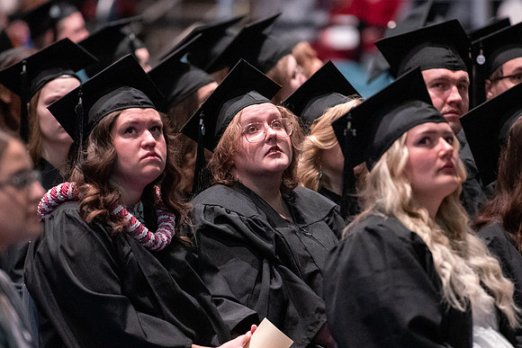 Graduates receive their diplomas during Performing and Visual Arts convocation.