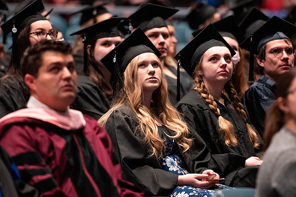 Graduates receive their diplomas during Performing and Visual Arts convocation.