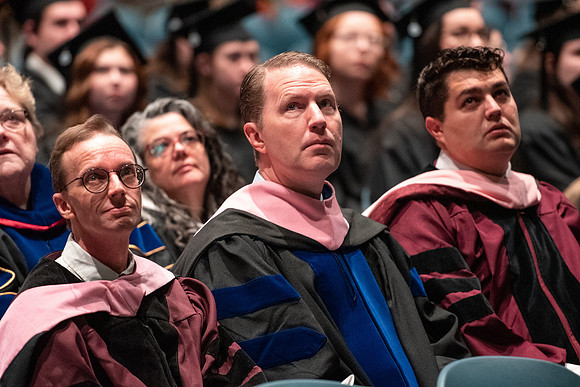 Graduates receive their diplomas during Performing and Visual Arts convocation.