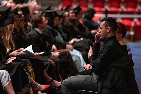 Graduates receive their diplomas during Performing and Visual Arts convocation.
