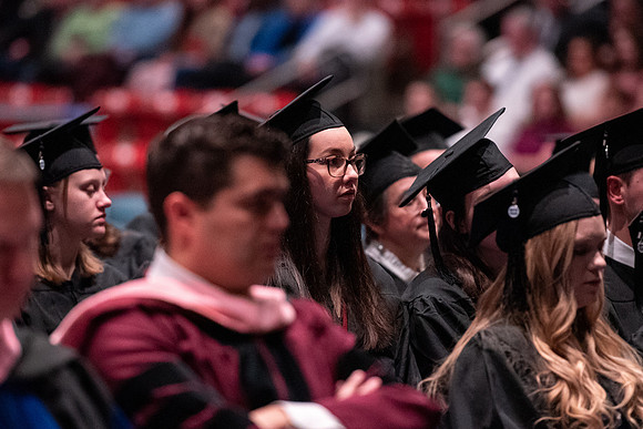 Graduates receive their diplomas during Performing and Visual Arts convocation.