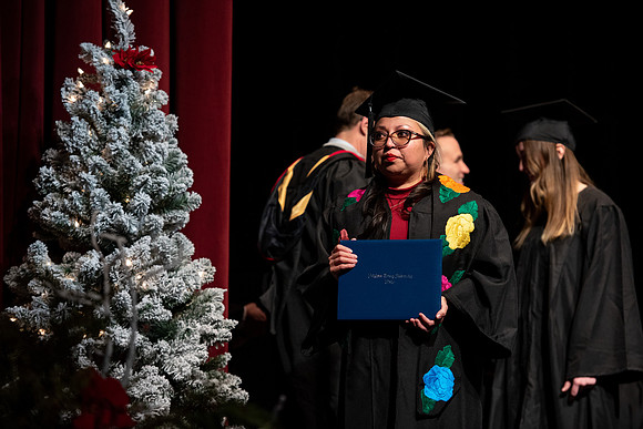 Graduates receive their diplomas during Performing and Visual Arts convocation.