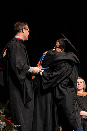 Graduates receive their diplomas during Performing and Visual Arts convocation.