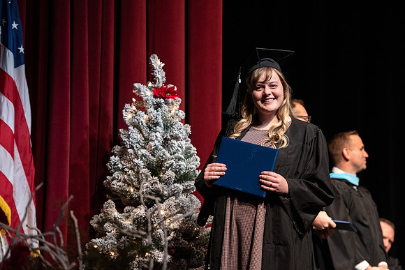 Graduates receive their diplomas during Performing and Visual Arts convocation.