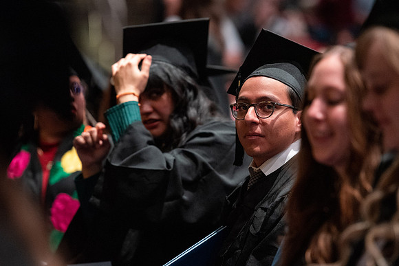Graduates receive their diplomas during Performing and Visual Arts convocation.