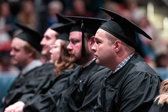 Graduates receive their diplomas during Performing and Visual Arts convocation.