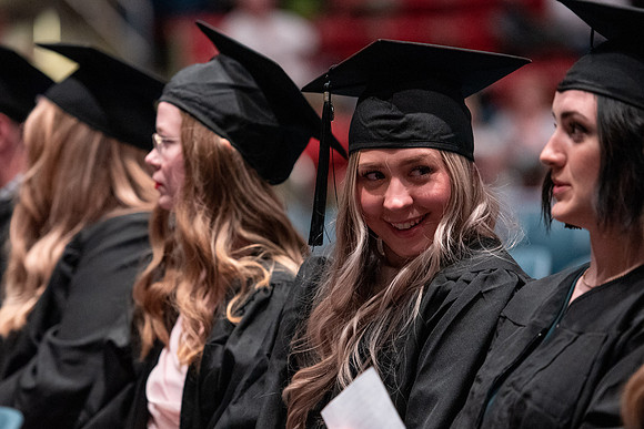 Graduates receive their diplomas during Performing and Visual Arts convocation.