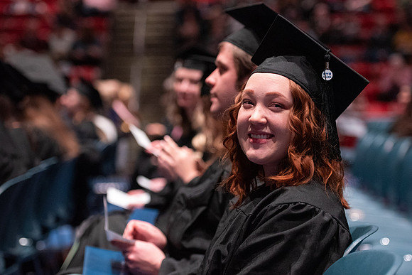 Graduates receive their diplomas during Performing and Visual Arts convocation.