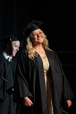 Graduates receive their diplomas during Performing and Visual Arts convocation.