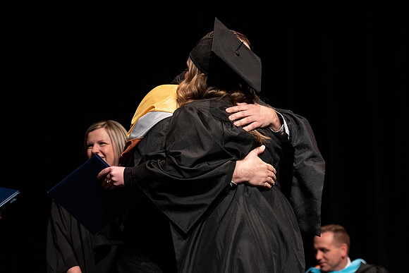 Graduates receive their diplomas during Performing and Visual Arts convocation.